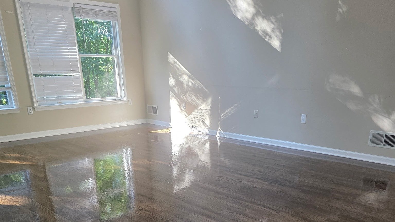 Refinished hardwood floor with dark stain and gloss finish in a York, PA home
