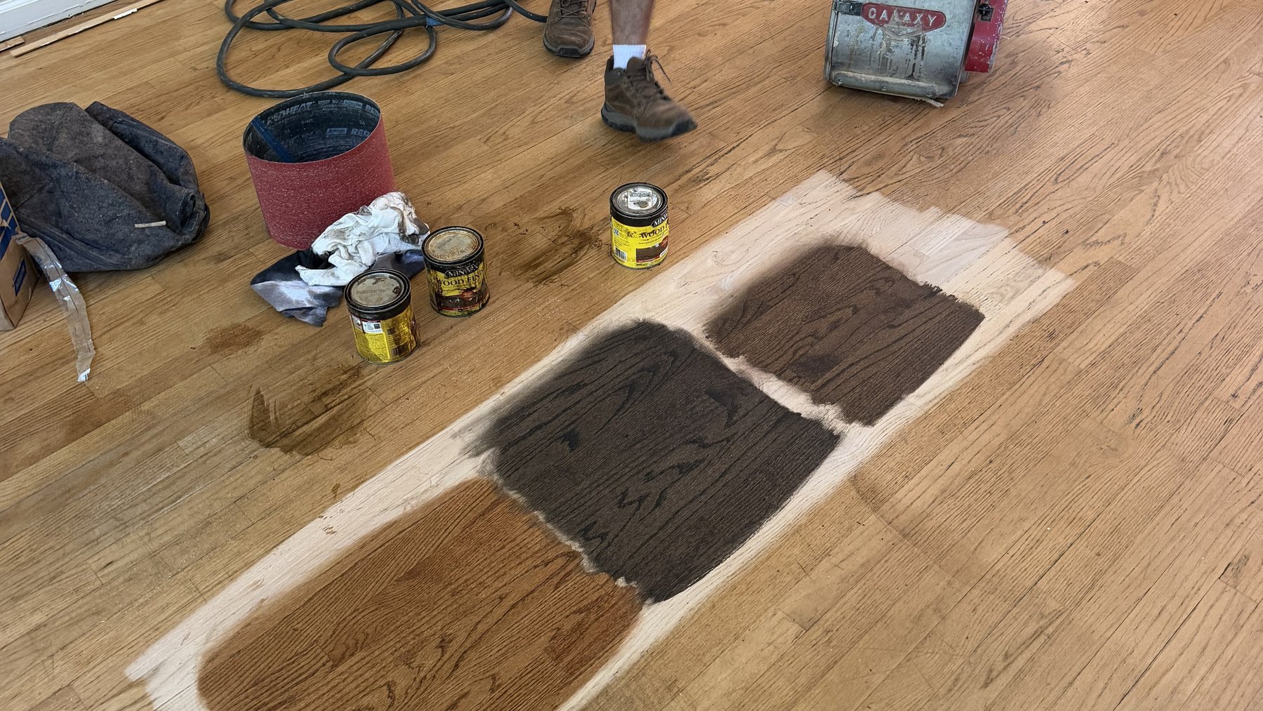 Stain samples brushed onto a customer's sanded oak floor in York, PA