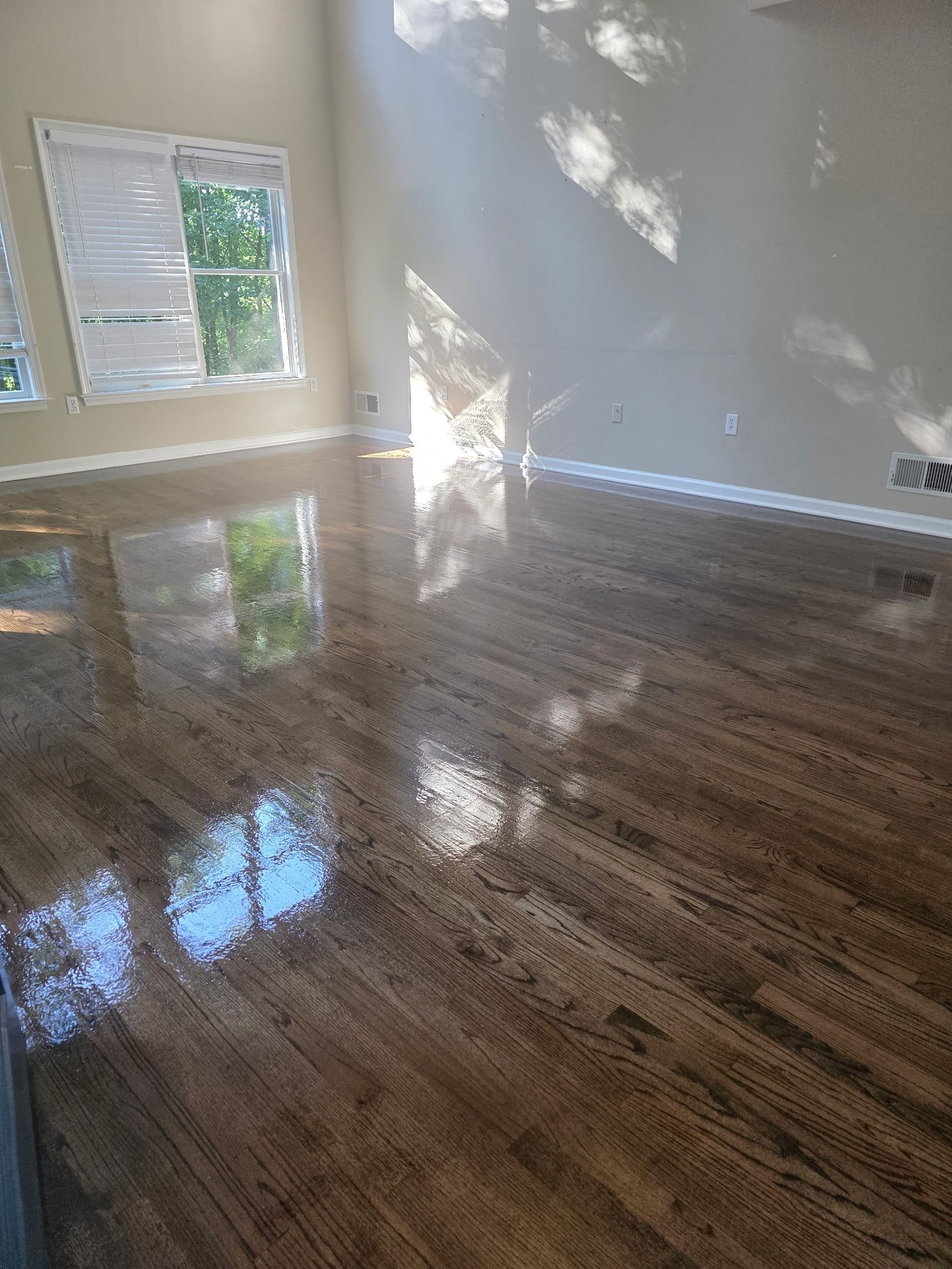 Hardwood floor refinished by Bleecker St. Development in York, PA - dark stain, gloss finish