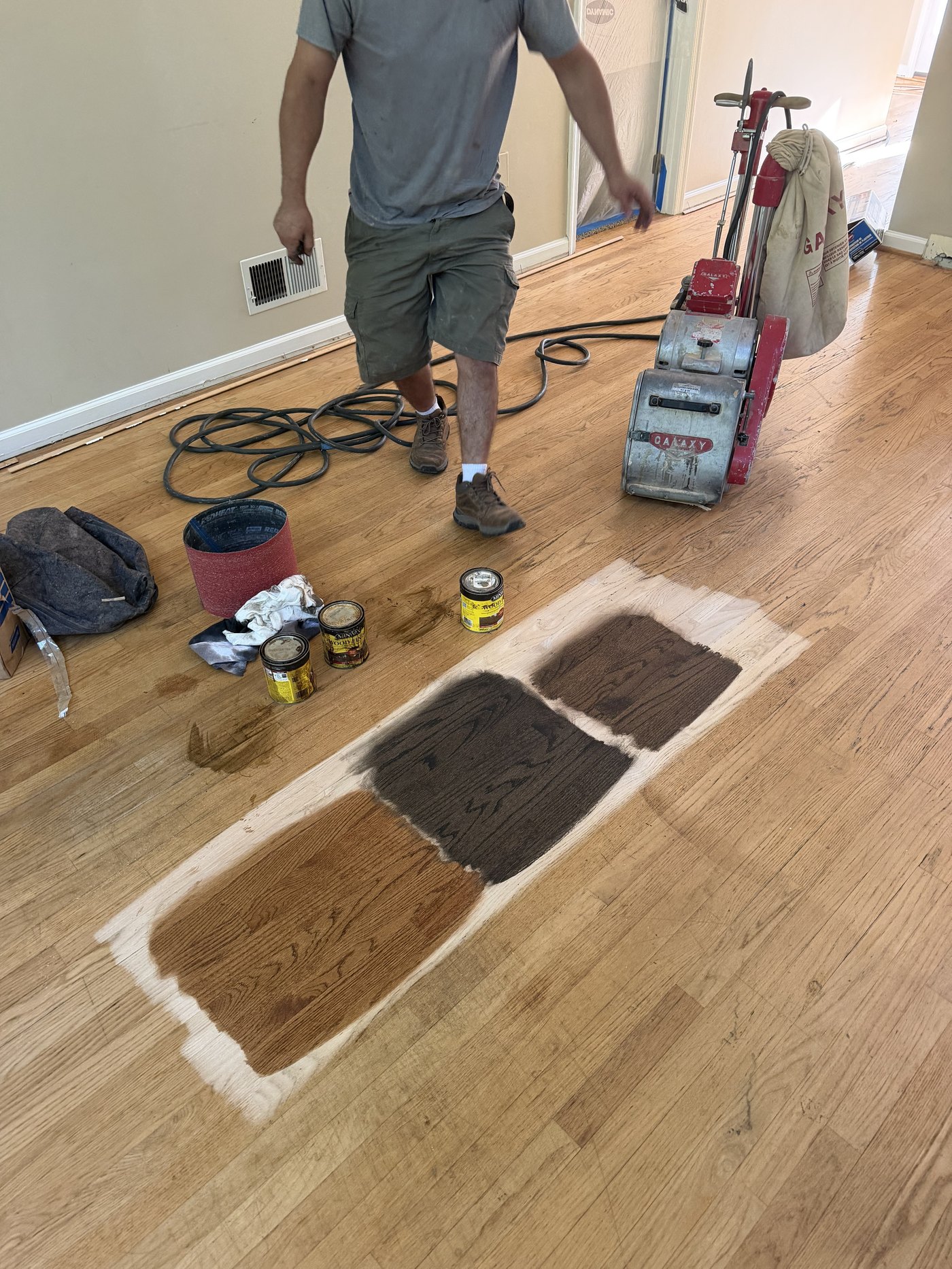 Three stain samples brushed onto a customer's sanded oak floor in York, PA